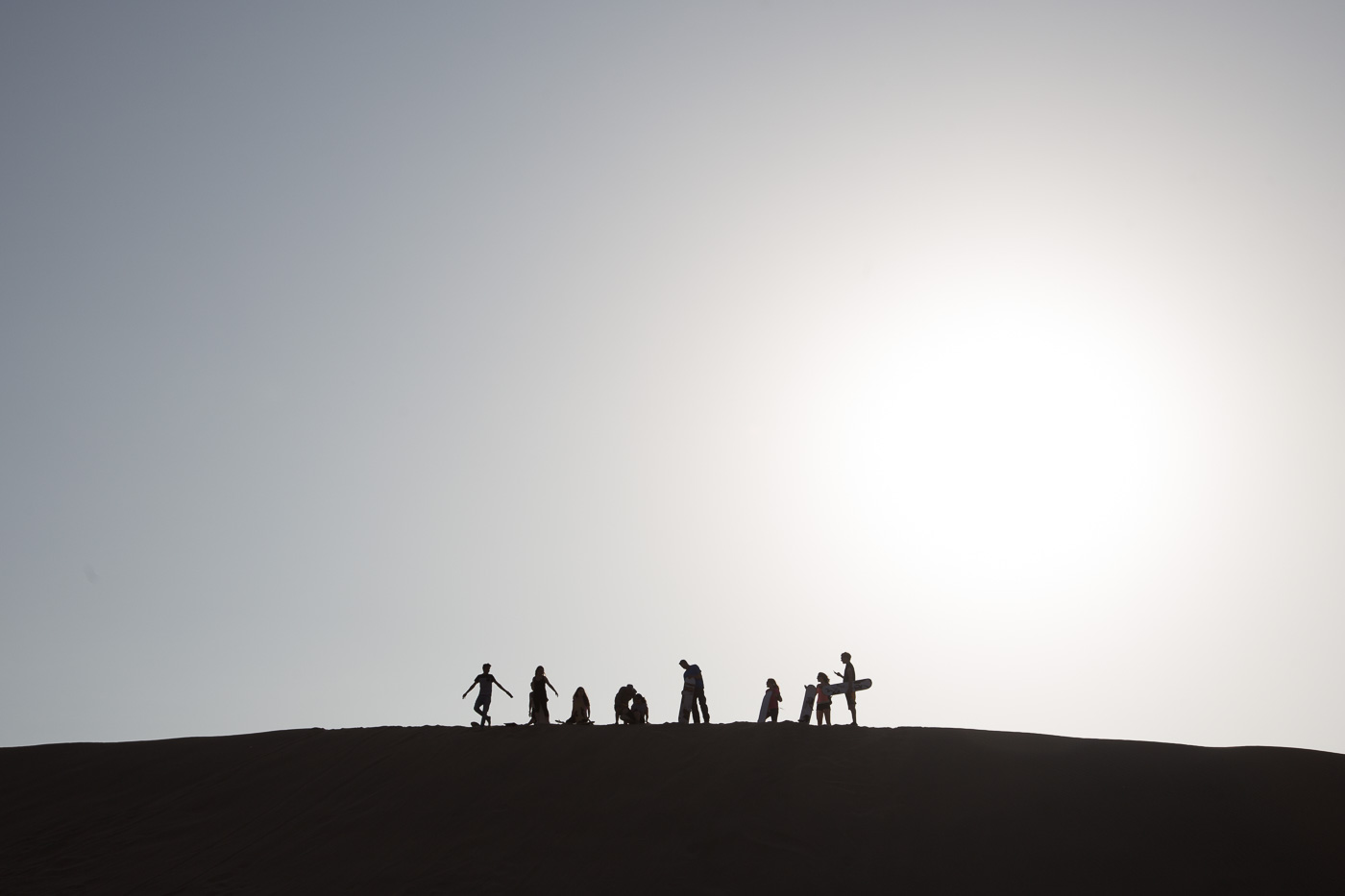 Testing out the sand boards on a dune in Huacachina