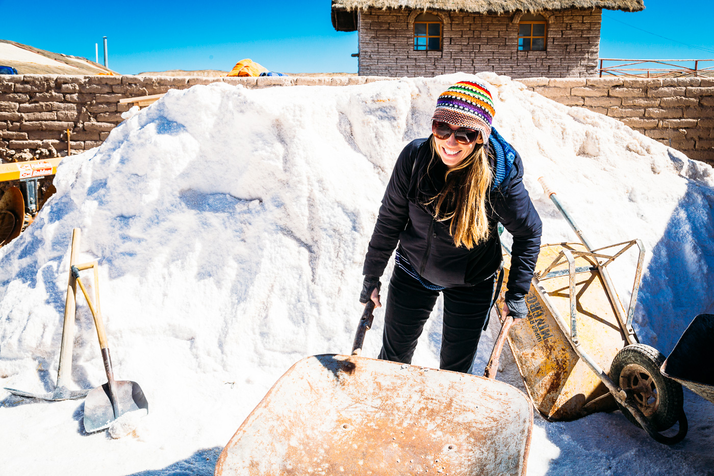 Helping wheel the salt around at the Salt Cooperative in Colchani, Salar de Uyuni - Bolivia