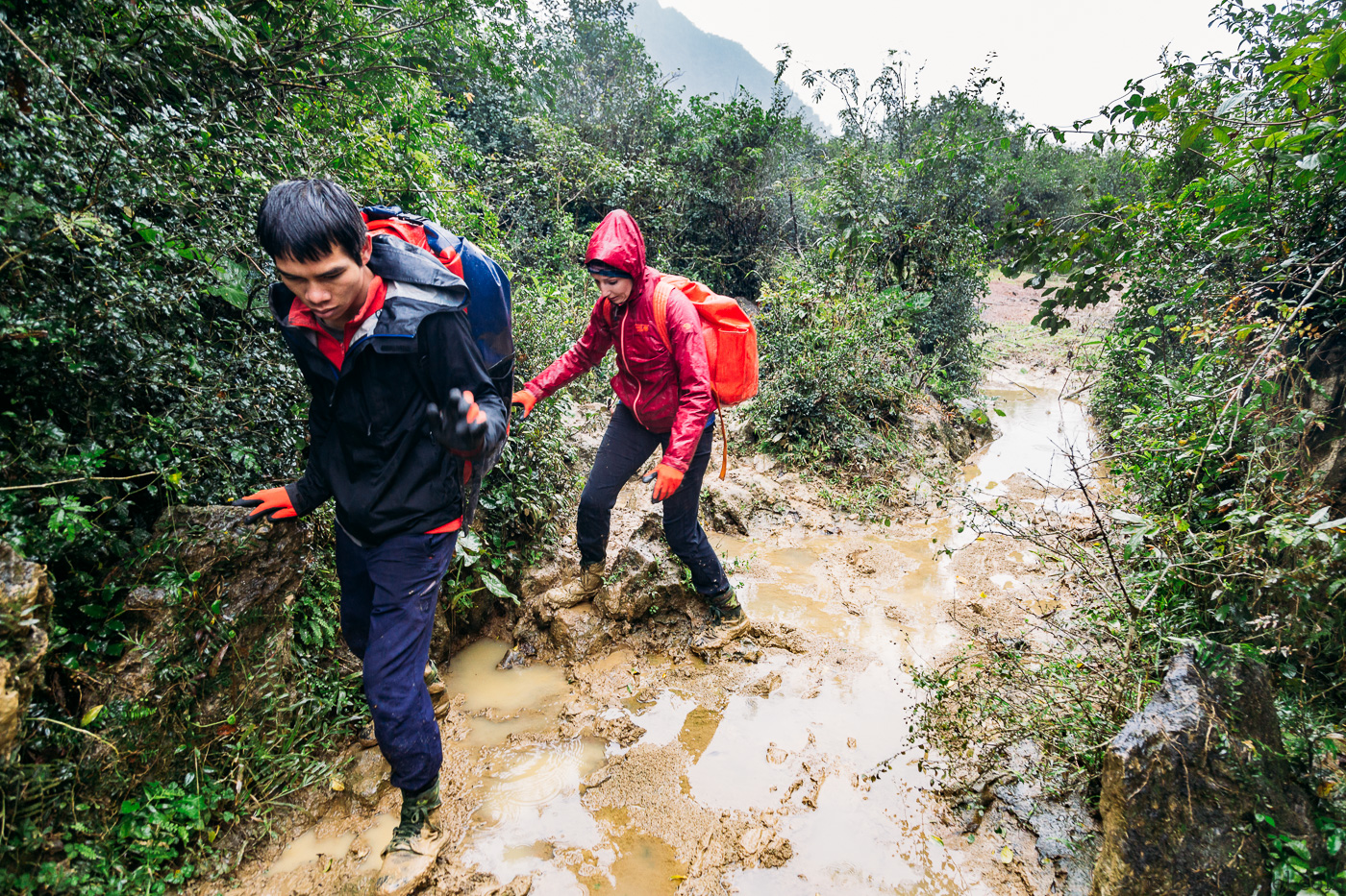 Dodging the mud on our Tu Lan Jungle Challenge tour with Oxalis in Phong Nha Vietnam