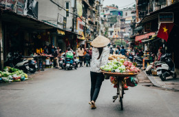 A fruit vendor walking the streets of Hanoi during our street food tour