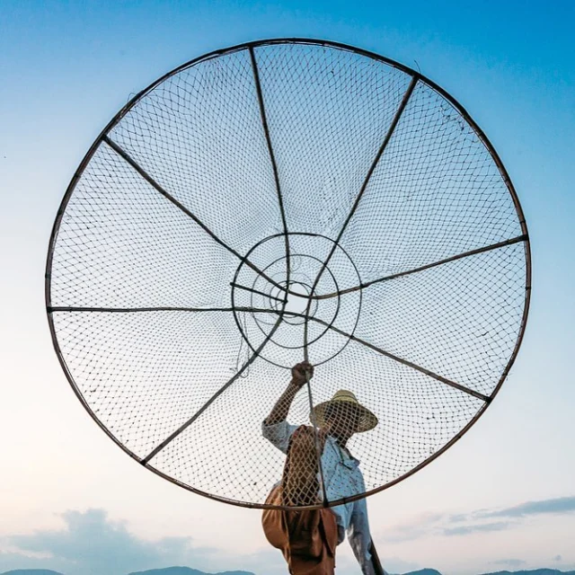 A fisherman of Inle Lake showing off his fishing basket skills. #myanmar #inle #fisherman