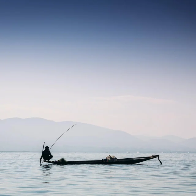 A fisherman waiting for his early morning catch on Inle Lake. #myanmar #inlelake #fisherman #sunrise